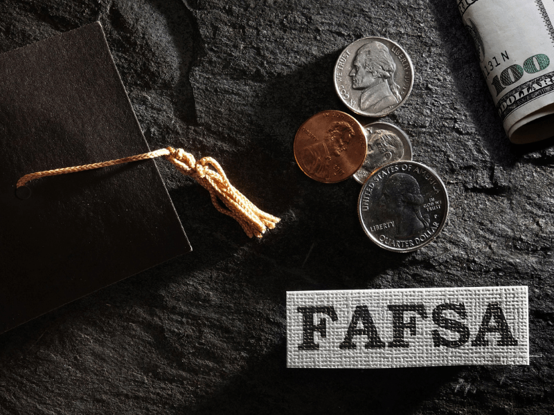Graduation Cap, Money and Sign that Says FAFSA